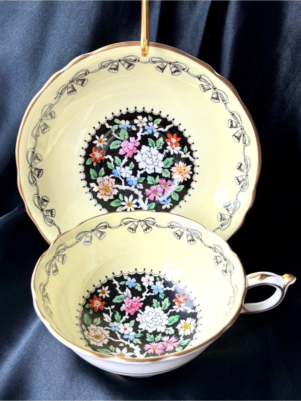PARAGON Double Warrant Light Yellow Floral & Black Medallion Teacup and Saucer